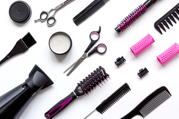 combs and hairdresser tools on white background top view