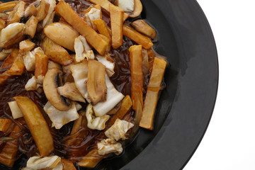 Fried potato chips with mushrooms in sauce