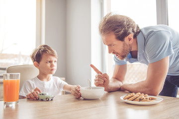 Father and son in kitchen