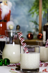 Glass of Eggnog With Candy Cane Stir Stick