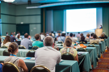 Speaker Giving a Talk at Business Meeting. Audience in the conference hall. Business and...
