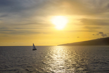 lonely yacht at sunset