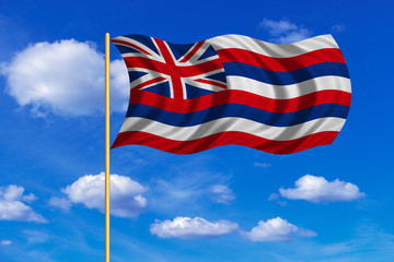 Flag of Hawaii waving on blue sky background