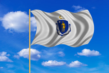 Flag of Massachusetts waving on blue sky backdrop