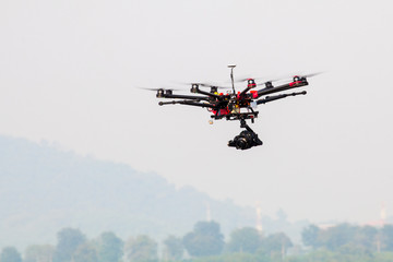 Fototapeta na wymiar drone with professional camera flying.