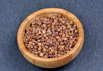 Brown buckwheat in a bamboo bowl