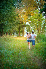 Fototapeta premium happy family walks in the park