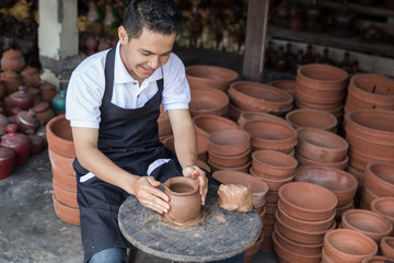 craftsman artist making pottery