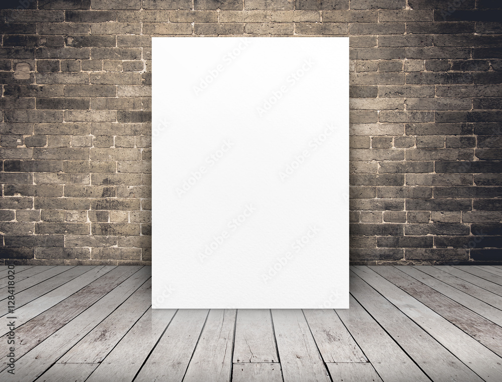 Wall mural blank white paper poster at grunge brick wall and wood plank flo