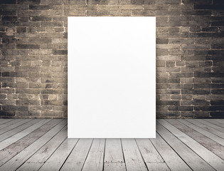 Blank white paper poster at grunge brick wall and wood plank flo