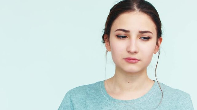 Portrait cute girl 14 years old looking at camera on white background