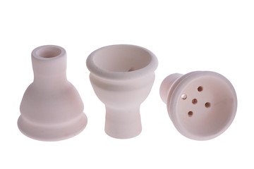 hookah bowl for tobacco shisha three ceramic products with short legs, three beige pottery with five holes, three clay bowls arranged in a row, three ceramic vessels