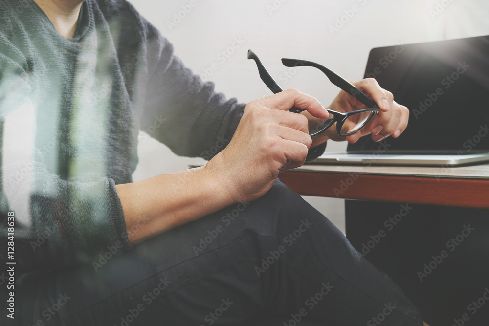 Aufkleber website designer holding eyeglass working computer laptop on woo