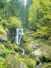 Triberg waterfalls and surrounding forest in Schwarzwald (Black forest), interesting place for hiking, in autumn season