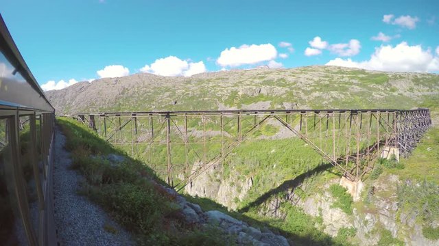 White Pass and Yukon Route Railroad Scenic Train Ride Passing Old Wooden Bridge Not In Use