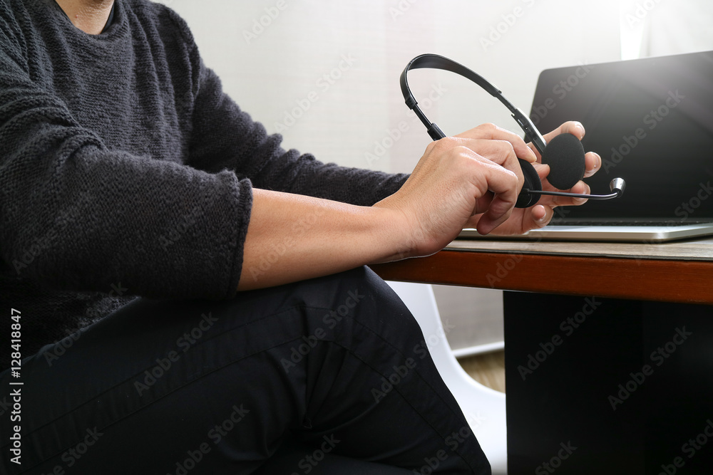 Poster Man using VOIP headset with digital tablet computer docking smar