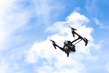 Modern quadcopter drone flying