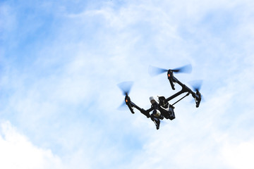 Modern quadcopter drone flying