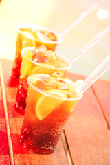 Concept of luxury tropical vacation. Three Cuba Libre cocktails