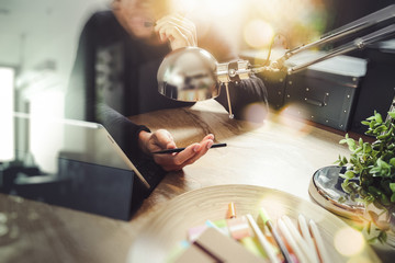 Man using VOIP headset with digital tablet computer docking smar