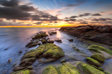 Dramatic cloud during sunset with green moss. image may contain soft focus and blur due to long exposure.