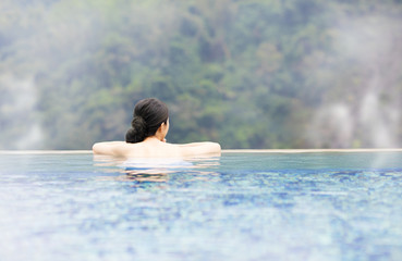 young woman relaxing in  hot springs