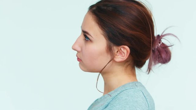 Resentment. Portrait cute girl 14 years old on white background