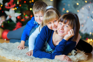 Happy family in festive studio.