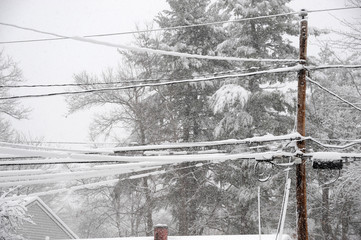 snow accumulated on power line after snow storm