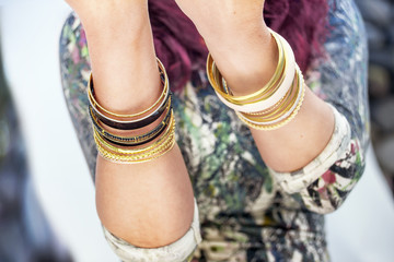 Female's hands with golden bracelets