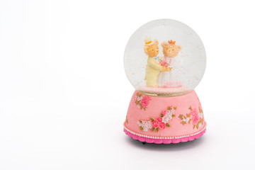 Fototapeta na wymiar Teddy Bear bride and groom in glass sphere.