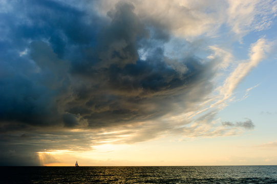 Fototapeta  Ocean Storm Sailboat Sunset Approaching Looming Dramatic Hope Faith Sky