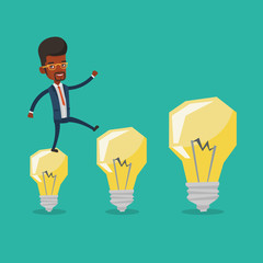Businessman jumping on idea light bulbs.