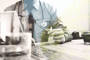 Double exposure of smart medical doctor working with digital tab