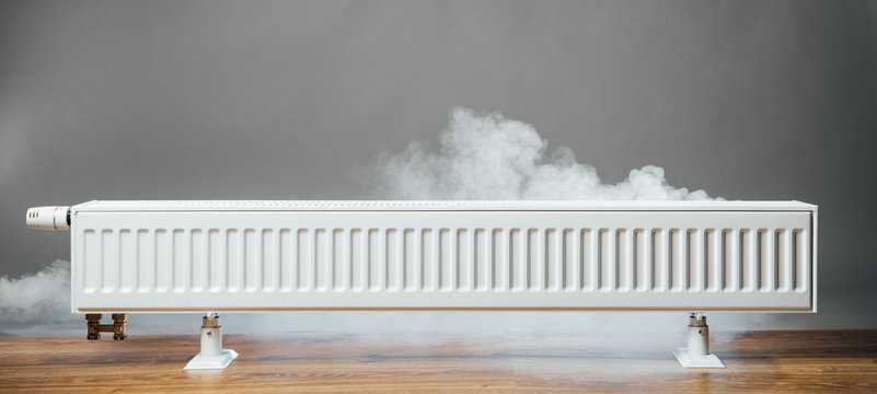 heating radiator at home with warm steam