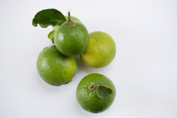 .Keep fresh lemon sour vitamin C from fresh green on a white bac