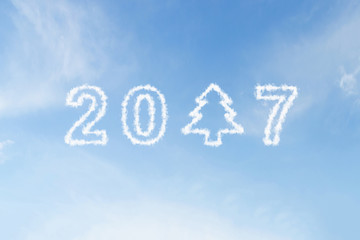 Naklejka na ściany i meble 2017 and christmas tree cloud on blue sky