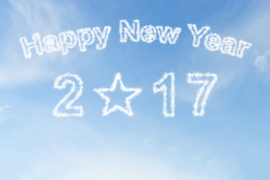 Happy new year 2017 and star shape cloud on blue sky