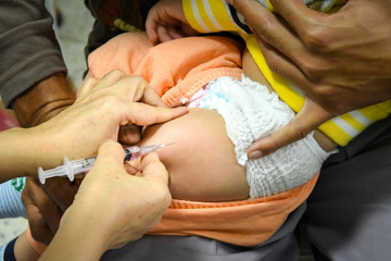 Children receiving vaccine at out side of the thigh.Children vac