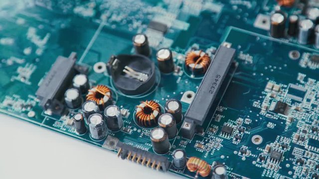 The IC chip resistors, chip components. Passive Components PCB micro: resistors and capacitors. Electrical engineering. Working with the chips. High-tech manufacturing. Circuit board production.