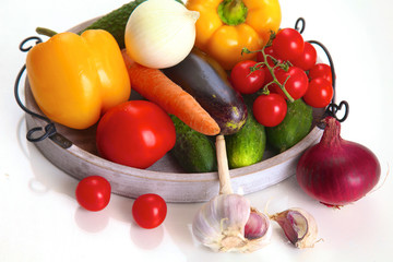 Fresh autumn vegetables on a white background