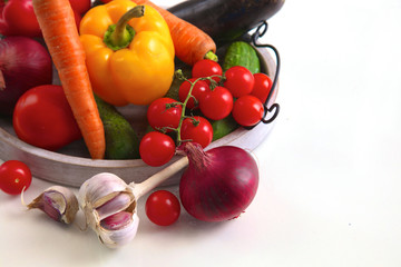 Fresh autumn vegetables on a white background