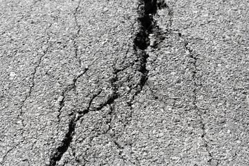 Surface asphalt street road cracked and broken