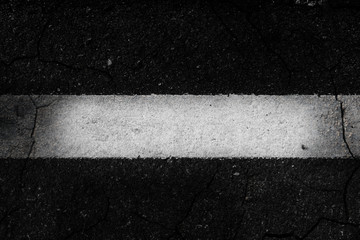 Fototapeta premium Crack asphalt the white line background.