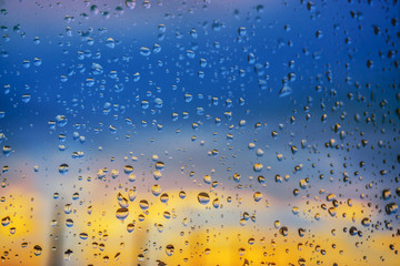 Fototapeta na wymiar Abstract background. Drops of water on the window.