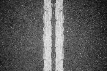 Fototapeta premium Double whit lines on asphalt background.