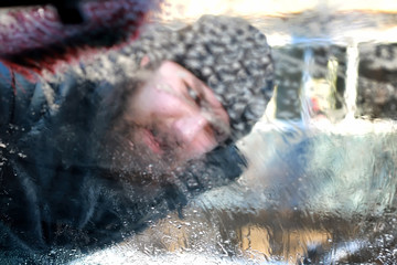 winter man brush car snow