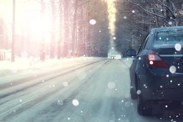 car on road trees winter sunset