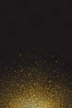 gold glitter texture isolated on black background
