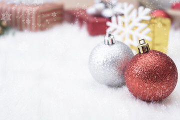 Christmas balls with gift box and snowflake on white background.